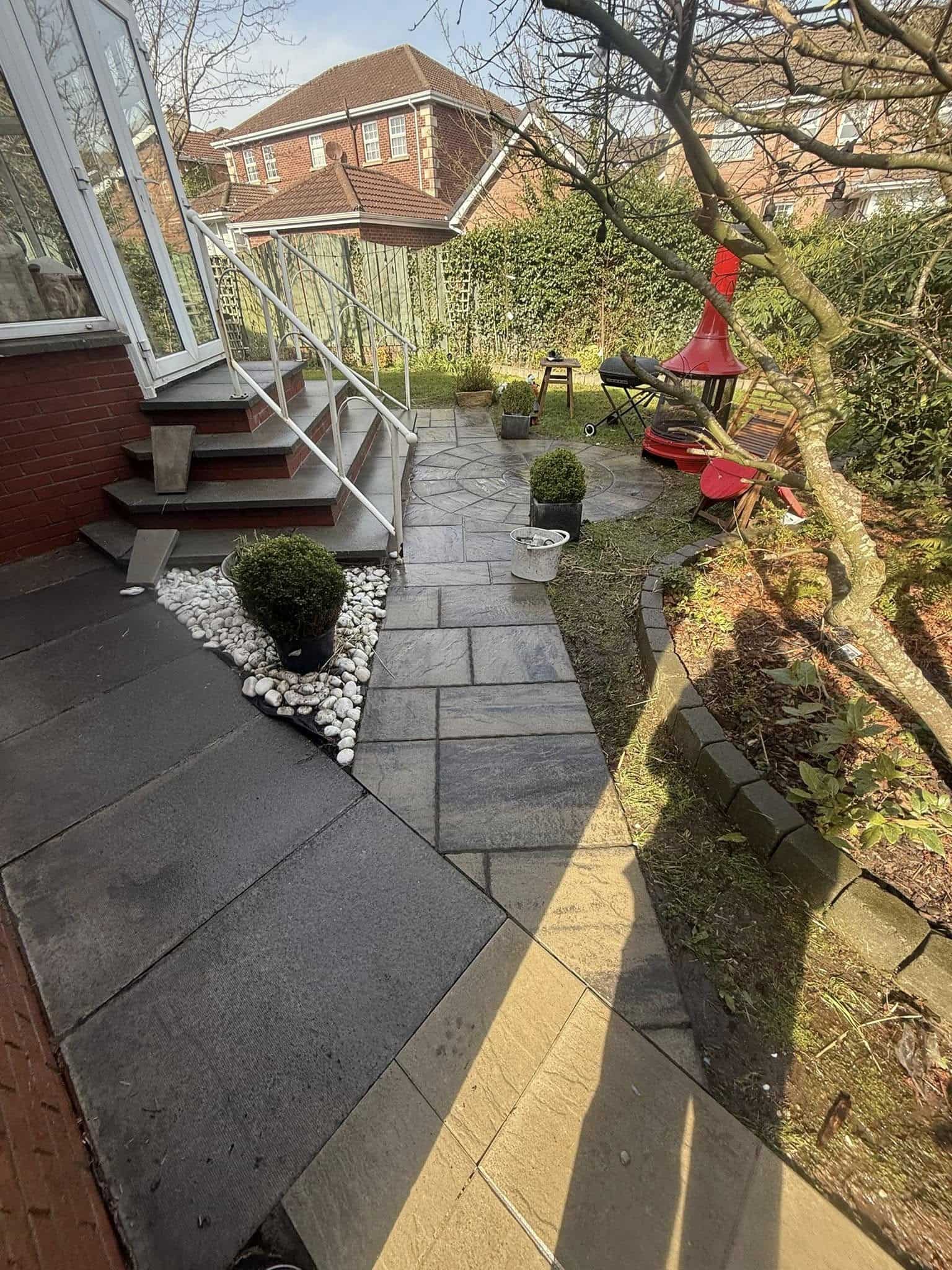 Pressure washing back garden tiles